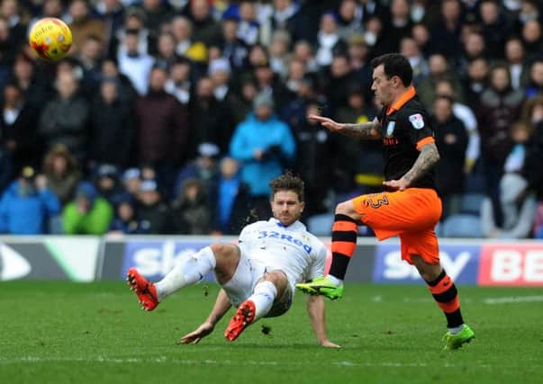 Leeds United's Gaetano Berardi wins the ball from Sheffield Wednesday's Ross Wallace during last year's clash at Elland Road which the hosts won 1-0..
 Picture: Jonathan Gawthorpe