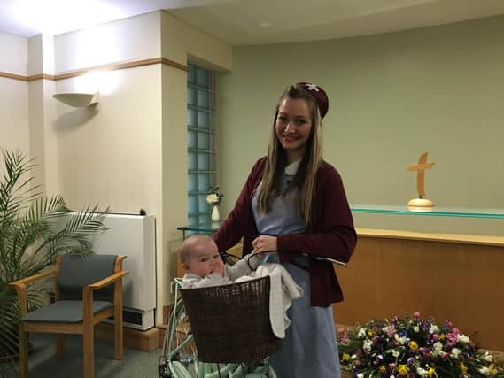 Midwife, Rebecca Davies and baby Harry.