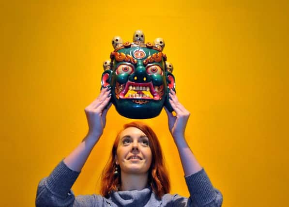 FASHION SENSE: Devon Allen, curator volunteer at the Lotherton Hall exhibition, with a Mahakala  protective power mask from Nepal.