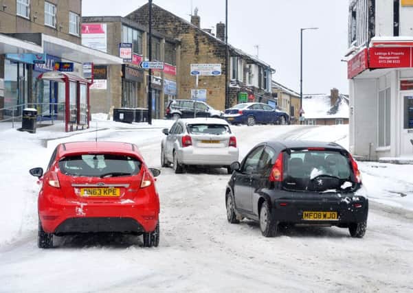18 March 2018 .......    Cars struggle to negotiate Lidget Hill Pudsey in the snow. Picture Tony Johnson.
