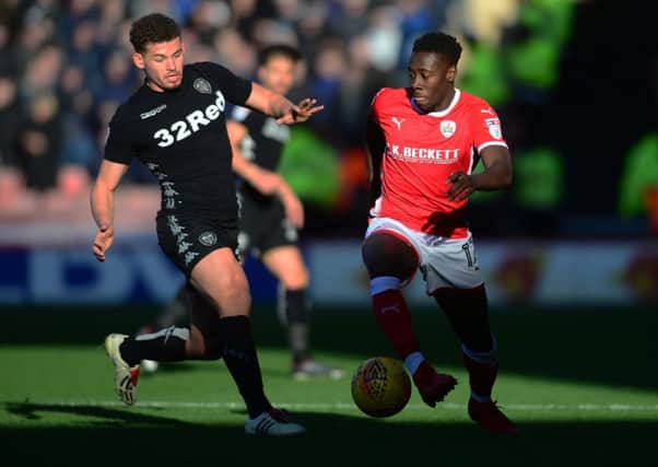Kalvin Phillips, of Leeds United, moves in on Barnsley's Andy Yiadom.