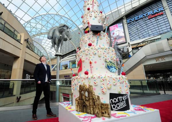 HAPPY BIRTHDAY: Trintys Dan Wharton with the three-metre high cake. PIC: Simon Hulme