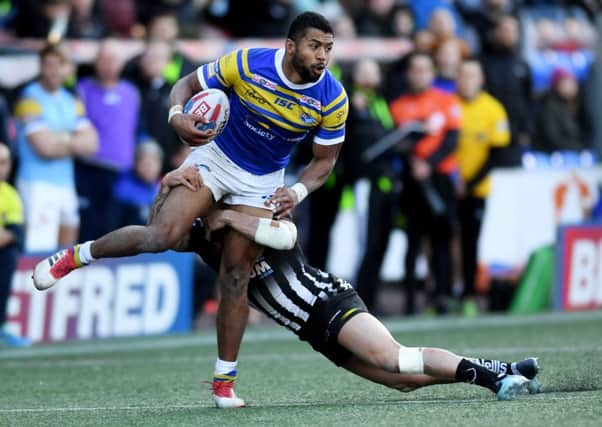 Kallum Watkins is tackled by Widnes Vikings' Danny Craven.