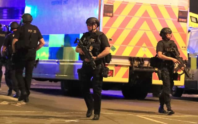 Armed police at Manchester Arena after the explosion at the venue during an Ariana Grande gig last year. PA