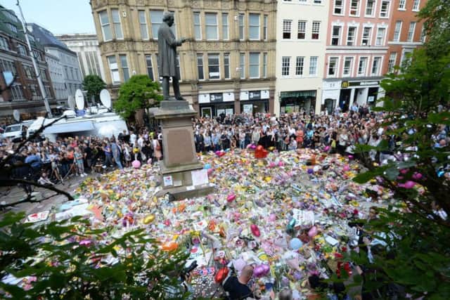 Tributes were paid at St Ann's Square, Manchester, to remember the victims of the terror attack at the Manchester Arena last year. The attack shocked people and showed the threat level in Britain is still high. (PA)