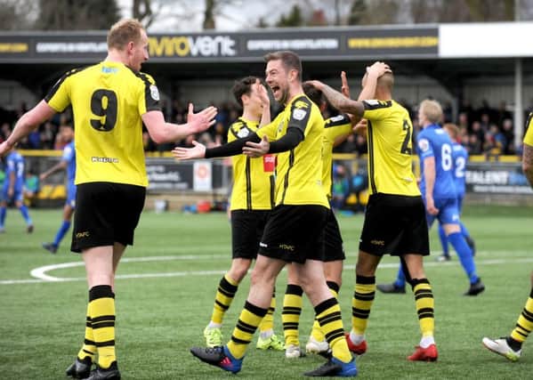 Mark Beck, left, is congratulated by Ben Parker after scoring Harrogate Town's second goal. Picture: Steve Riding.
