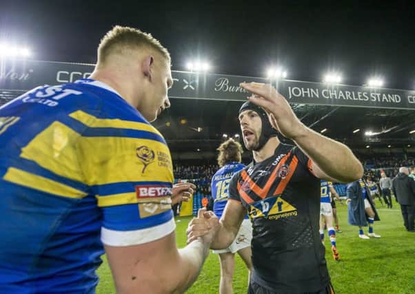 Castleford's Luke Gale consoles Leeds' players after their victory 25-24 victory at Elland Road. PIC: Picture by Allan McKenzie/SWpix.com