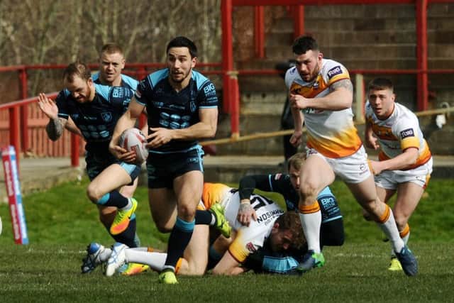 Tom Holmes makes a break during Sunday's Championship game between Batley Bulldogs and Featherstone Rovers. PIC: Jonathan Gawthorpe