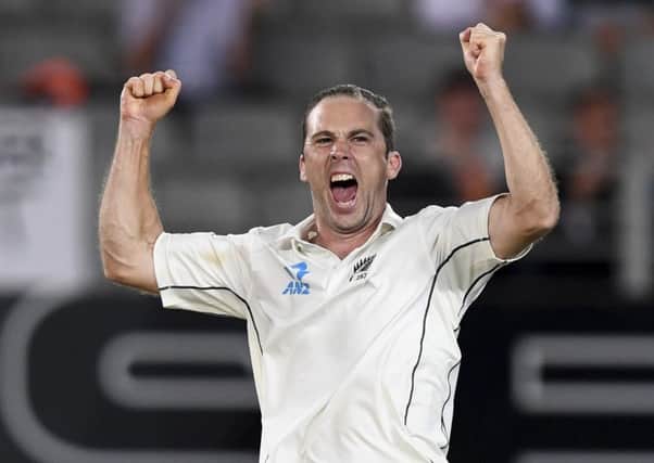 Got him: New Zealand's Todd Astle celebrates after taking the wicket of England's Craig Overton.