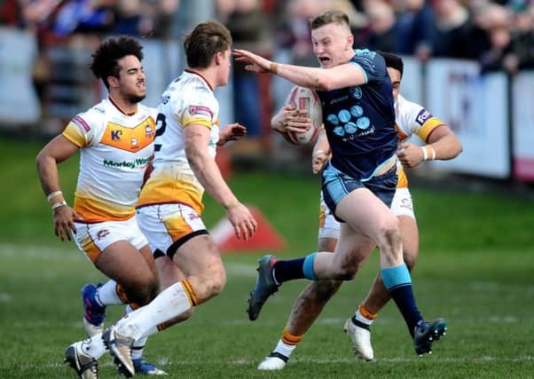 Featherstone Rovers' Harry Newman - on loan from Leeds Rhinos - gets away from Batley's Keenan Tomlinson. PIC: Jonathan Gawthorpe