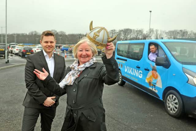 27 March 2018...... YEP competition winner Jacqui Cliff of Garforth officially opens Viking Airport Parking car park at Leeds Bradford Airport after coming up with the winning name for the car park's mascot, Karvik, pictured with Phil Forster, Aviation Development & Corporate Affairs Manager and Tim Walters, Car Park Supervisor. Picture Tony Johnson.