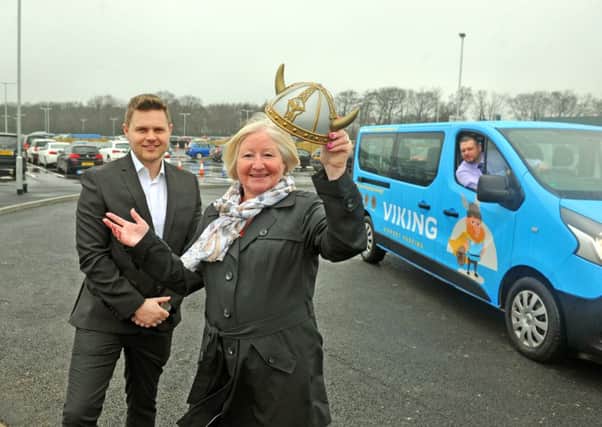 27 March 2018......     YEP competition winner Jacqui Cliff of Garforth officially opens Viking Airport Parking car park at Leeds Bradford Airport after coming up with the winning name for the car park's mascot, Karvik, pictured with Phil Forster, Aviation Development & Corporate Affairs Manager and Tim Walters, Car Park Supervisor. Picture Tony Johnson.