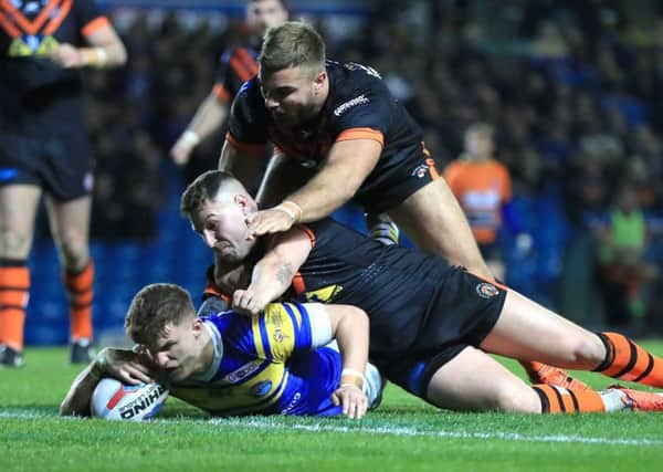 Leeds Rhinos' Ash Handley dives in to score his side's second try against Castleford.