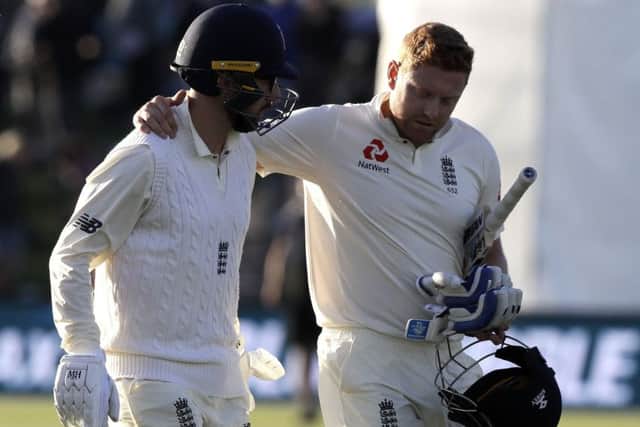 Hero: England's Jonny Bairstow, right, embraces teammate Jack Leach as they leave the field at the close of play on day one of the second Hest against New Zealand.