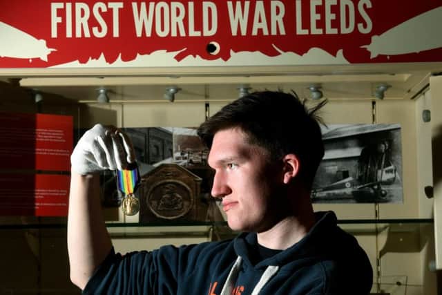 Joseph Enright with pilot Sydney Gillat's Victory medal.
 Picture Jonathan Gawthorpe