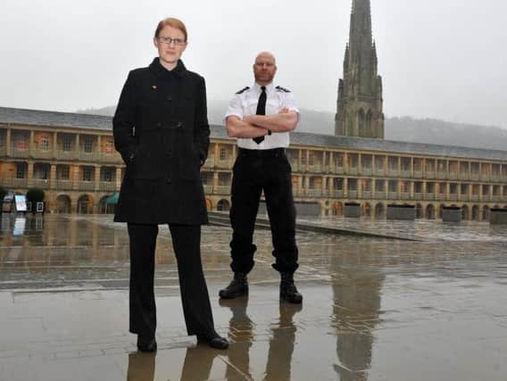Holly Lynch MP with Chief Insp Nick Smart, Chair West Yorkshire Police Federation on a walkabout  in the Piece Hall, Halifax. Picture Tony Johnson.