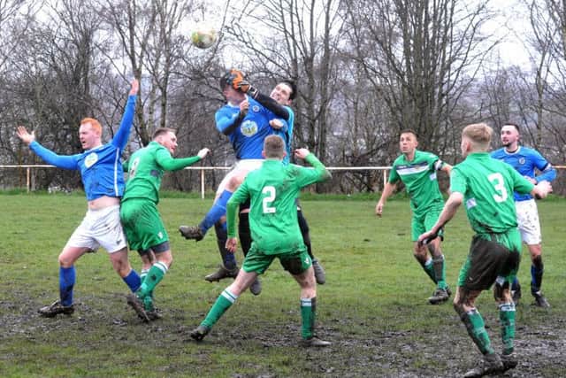 Jack Mills, of Calverley, is thwarted by Beeston St Anthony's goalkeeper Tom Kaye. PIC: Steve Riding