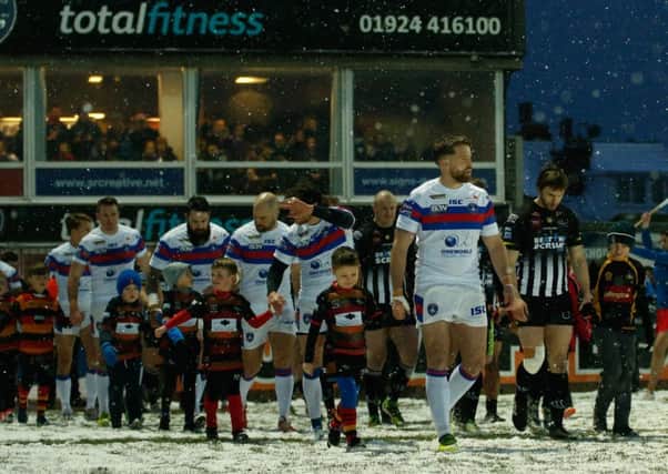 Danny Kirmond leads out his players in the recent snow-hit fixture with Widnes. PIC: Stephen Gaunt/Touchlinepics.com