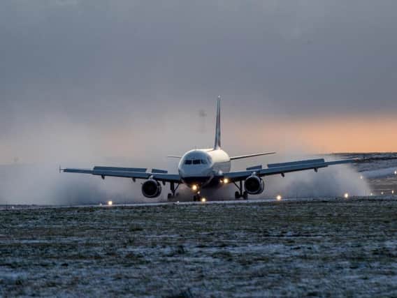 A flight lands at Leeds Bradford Airport. Photo: Charlotte Graham