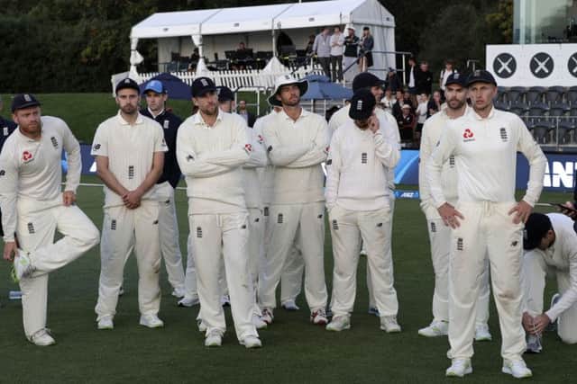 England captain Joe Root, right, stands with his team following the final day of the second Test against New Zealand at Hagley Oval. Picture: AP/Mark Baker