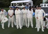 England captain Joe Root, right, stands with his team following the final day of the second Test against New Zealand at Hagley Oval. Picture: AP/Mark Baker