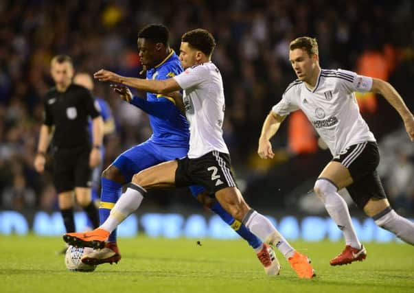 Caleb Ekuban battles for the ball with Fulham's Ryan Fredericks. PIC: James Hardisty