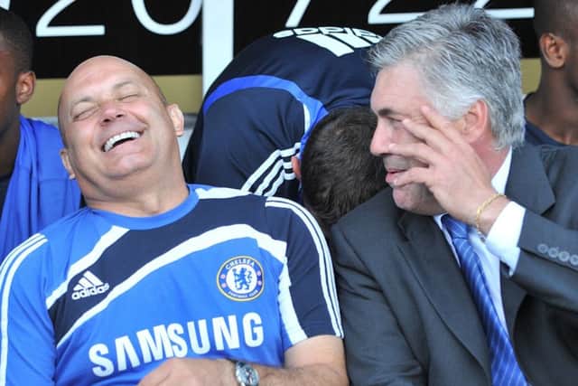 Ray Wilkins shares a joke with then-Chelsea manager Carlo Ancelotti. PIC: Rebecca Naden/PA Wire