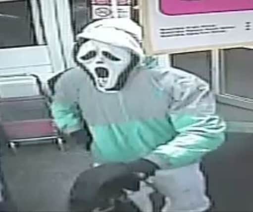 ROBBERY: A CCTV image of the Scream-mask wearing robber who terrified Leeds supermarket staff