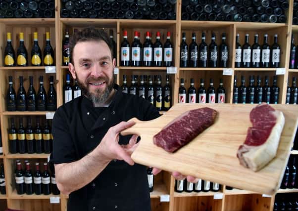 Andrea D'Ercole, owner and chef, who started Ipsum Vinoteca in 2014 and
writes a new menu every single day. Pictured with his aged meat.
6th April 2018.