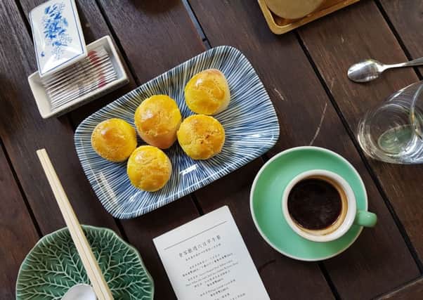 Pineapple buns and coffee for brunch at Duddell's. PIC: PA