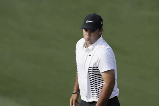 Patrick Reed reacts after missing a par putt on the 10th hole during the second round at the Masters. Picture: AP/David J. Phillip