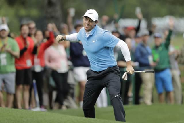 Get in: Rory McIlroy reacts after his eagle on the eighth hole during the third round. Picture: AP Photo/David J Phillip