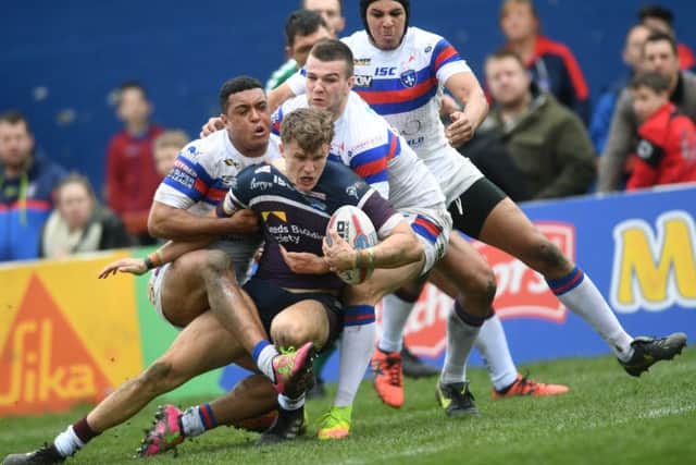 Ash Handley forces his way over for his try against Wakefield. PIC: Jonathan Gawthorpe