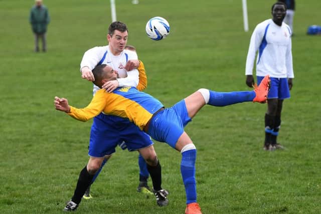 Daniel Stimpson and Mark Donnelly get into a tangle. PIC: Jonathan Gawthorpe