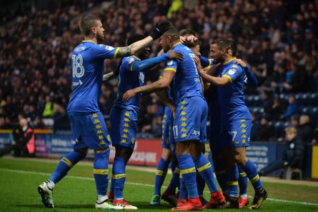 Kemar Roofe and Leeds celebrate his opening goal.