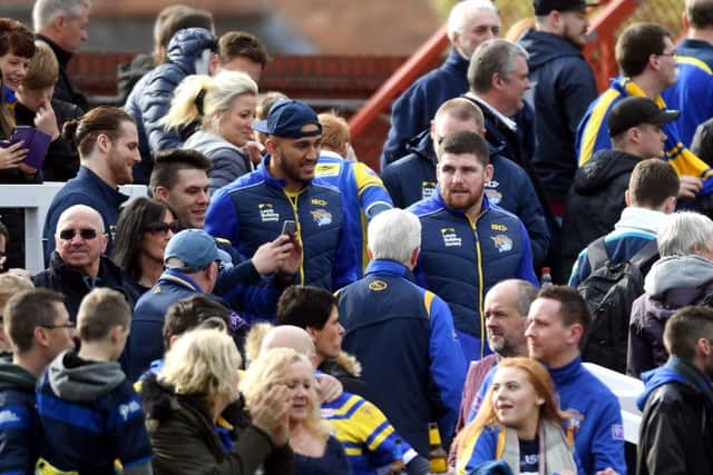 Nathaniel Peteru and Mitch Garbutt in with the Leeds fans at Wakefield on Sunday.