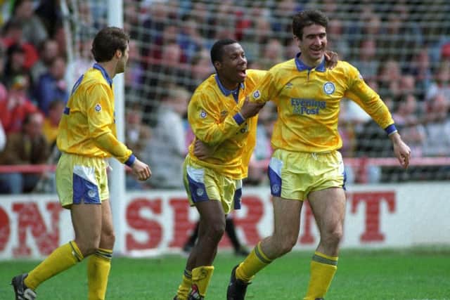Eric Cantona celebrates.