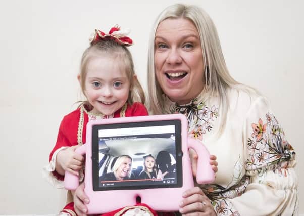 Julie Britton with her daughter Connie-Rose Seabourne who has Downs Syndrome, at their home in Leeds, after they appeared on a James Corden backed carpool karaoke video that has gone viral with over a million of views. PRESS ASSOCIATION Photo. Picture date: Tuesday March 20, 2018. The video described by James Corden as "the most beautiful Carpool Karaoke ever" was release in support of World Down Syndrome Day, that takes place on Wednesday and features 50 mums and their children singing along to Christina Perri's multi-platinum selling track A Thousand Years. Photo credit should read: Danny Lawson/PA Wire