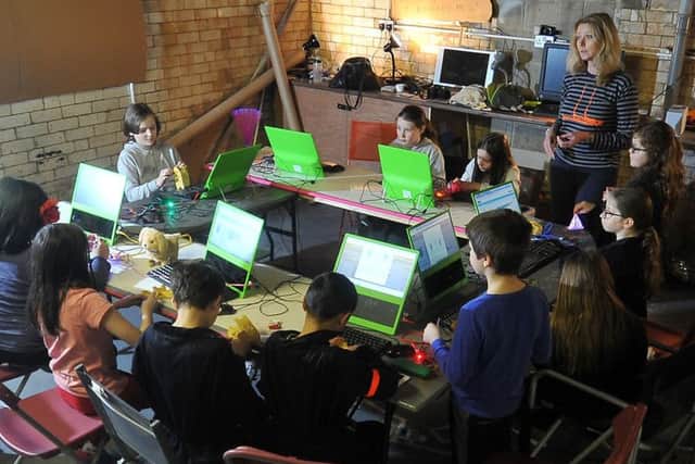 A cohort of young inventors busy in the basement at a Pop up PlayLab on New York Street, Leeds. PIC: Tony Johnson