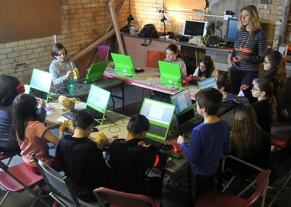 A cohort of young inventors busy in the basement at a Pop up PlayLab on New York Street, Leeds.  PIC: Tony Johnson