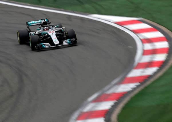 DRIVING FORCE: Britains Lewis Hamilton steers his Mercedes car during the second practice session in Shanghai. Pictures: AP/Andy Wong