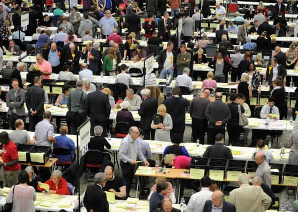 COUNT: Volunteers calculate the votes at the Leeds local elections in 2015. PIC: Jonathan Gawthorpe