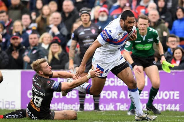 Wakefield's Bill Tupou gets away from St Helens' Danny Richardson. 
Picture: Jonathan Gawthorpe.