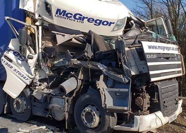Handout photo taken with permission from the twitter feed of @roadpoliceBCH of one of the two HGVs that crashed on the A14 at Godmanchester, Cambridgeshire.