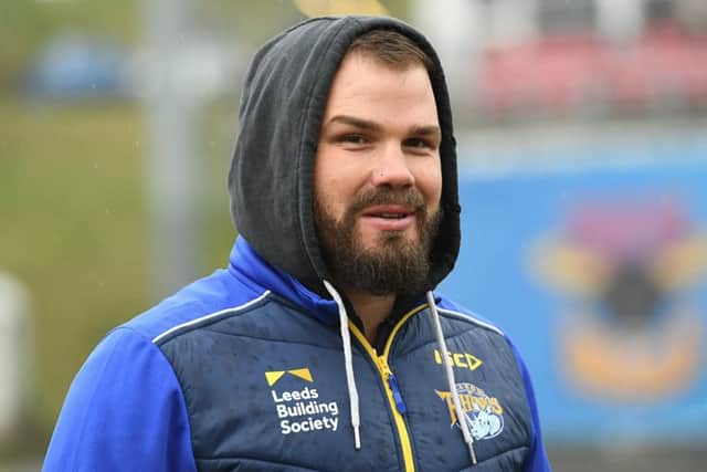 Leeds Rhinos Women's team coach Adam Cuthbertson watches from the sidelines.