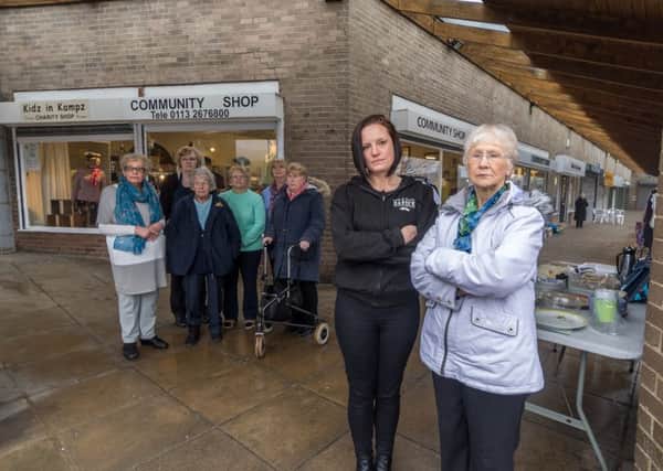 Traders and volunteers campaigning against the possible demolition of their businesses. Sarah Hardwick, owner of barbers Lads and Dads, with Madge Davey, Director of Kidz in Kampz Community Shop.