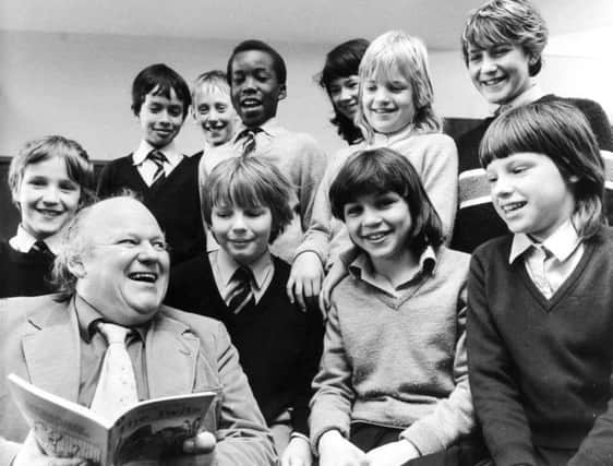 Leeds, Moortown, 12th April 1984

Comic actor Roy Kinnear turned to "The Twits" when he visited Allerton Grange Middle School, Moortown, Leeds.

The television and stage star, who is appearing this week at the Grand Theatre, Leeds, took tim eoff for a spot of story telling in the school hall and is pictured here with some of the second year pupils.