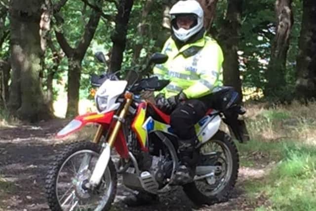 a police officer on an off-road bike