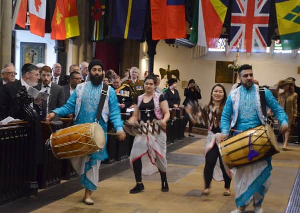Procession: Drummers and dancers from the Punjabi Roots Academy during the Commonwealth celebration at the Minster.