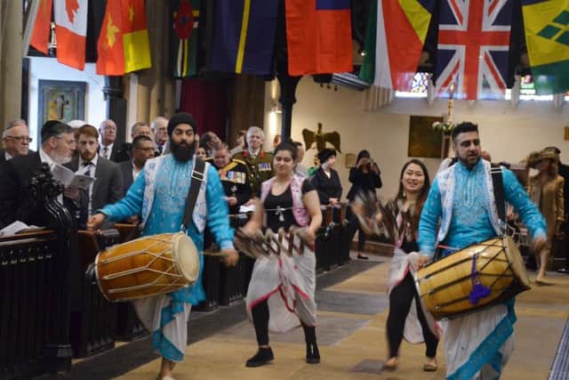 Procession: Drummers and dancers from the Punjabi Roots Academy during the Commonwealth celebration at the Minster.